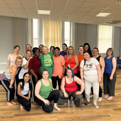 A group of female dancers smiling at the camera