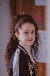 Headshot of a white woman looking at the camera