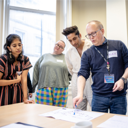 A group of people looking at building plans