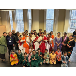 A group of Kathak dance performers on stage