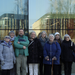 A group of elderly people smiling at the camera